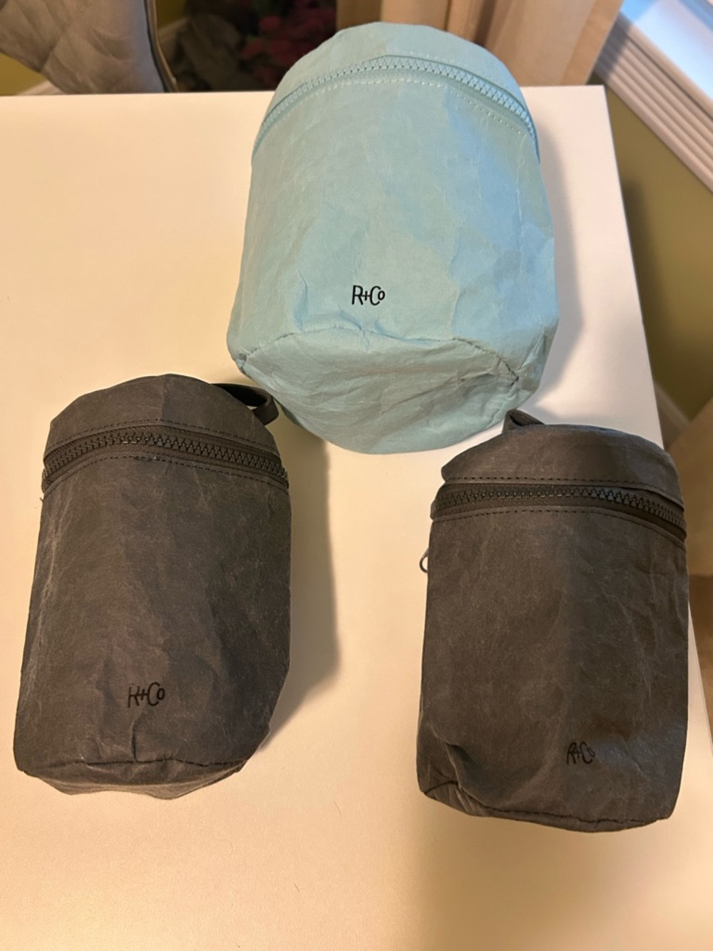 R+Co Made from paper Aqua and Charcoal Cylindrical Cosmetic Pouch Set of 3